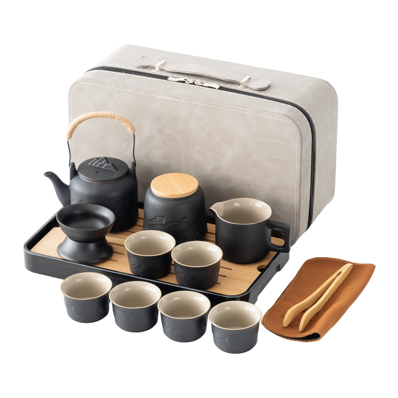 Complete six-cup ceramic travel tea set with a gray case, teapot, pitcher, strainer, jar, tray, cloth and tongs